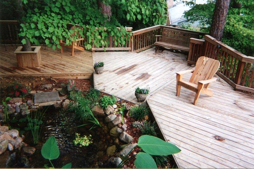 Wooden deck railing on multi level deck in Macon GA